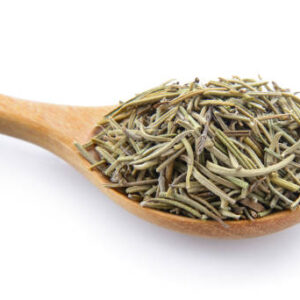 Dried rosemary leaves in wooden spoon over white background